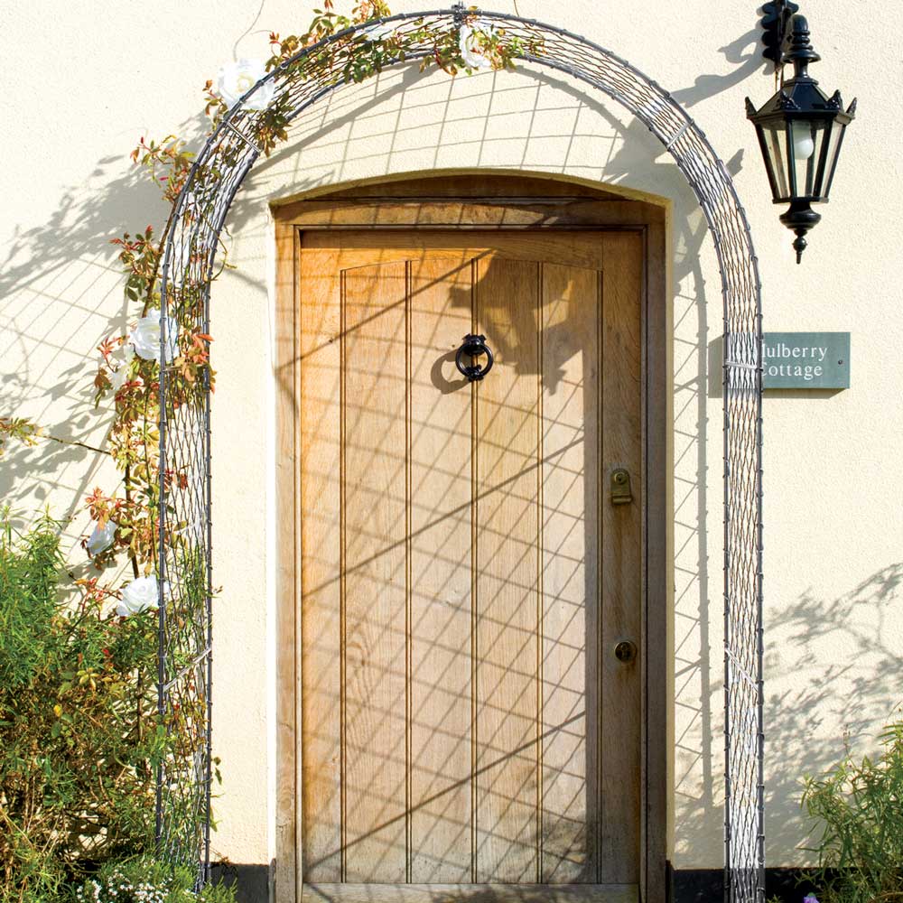 elegant round garden arch over a door