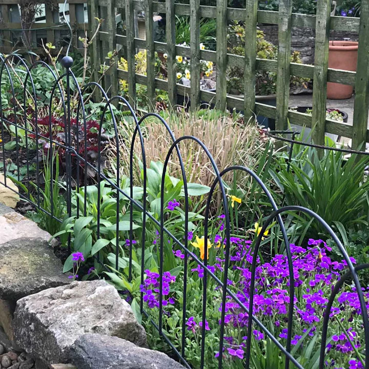 Lawn border edging - round, with flowers growing in the background